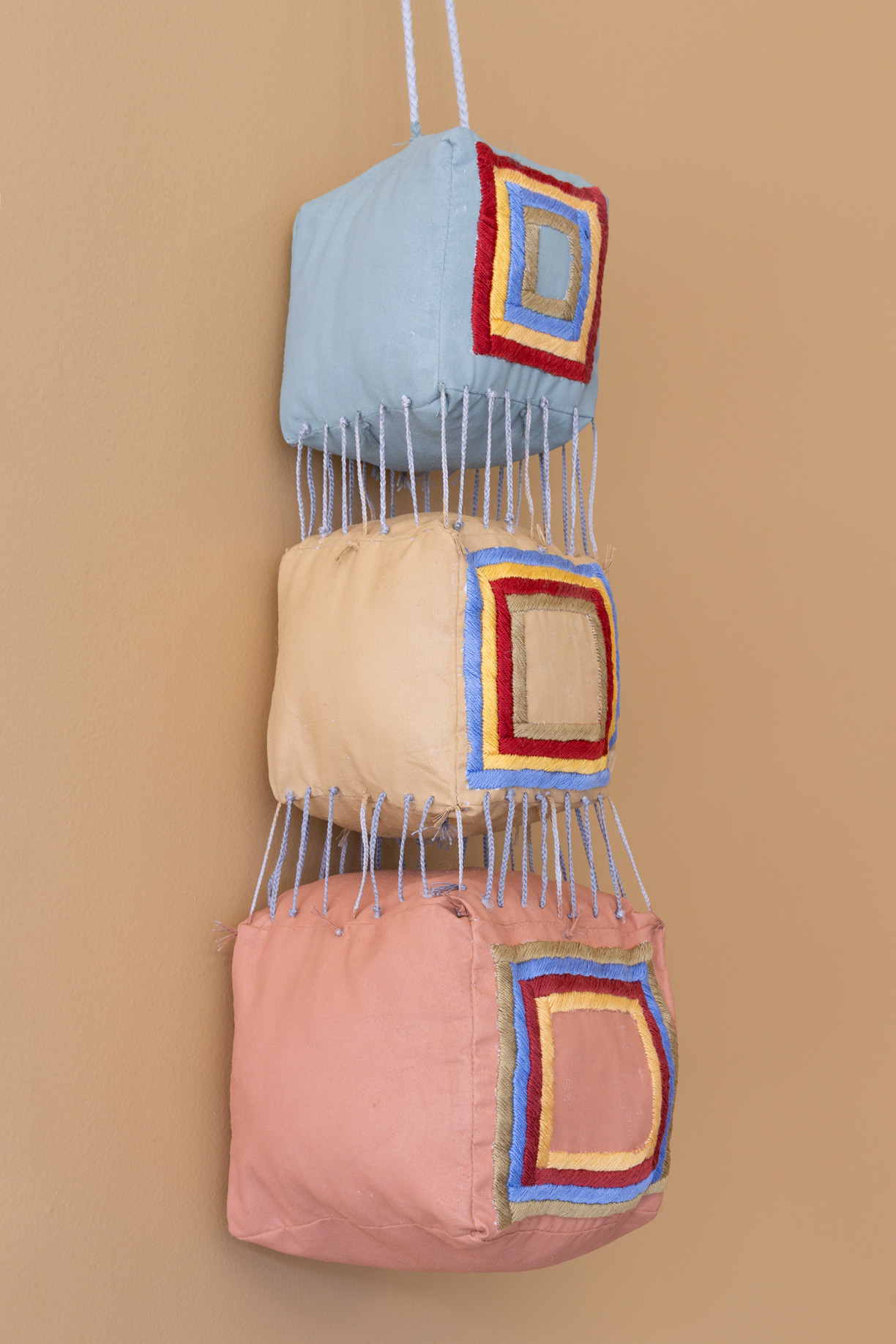 Hanging Cubes With Thin Plaits and Nicely Embroidered Inner Squares (detail)